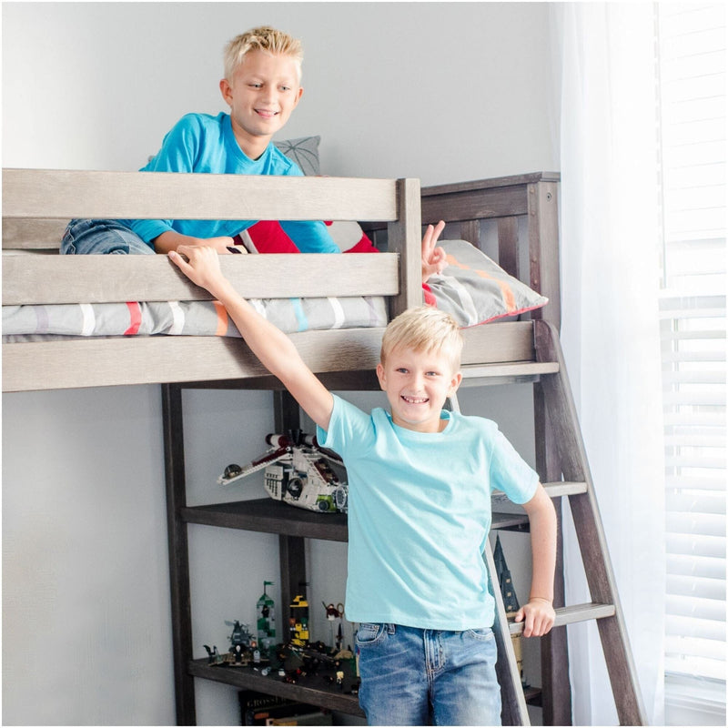 Two kids playing on a wooden bunk bed in a bright modern bedroom with striped bedding and LEGO toys on shelves