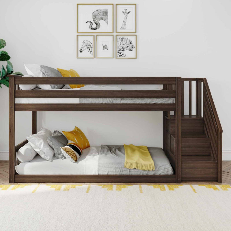 Stylish dark wood bunk bed with stairs in modern bedroom featuring animal-themed wall art and cozy yellow accents.