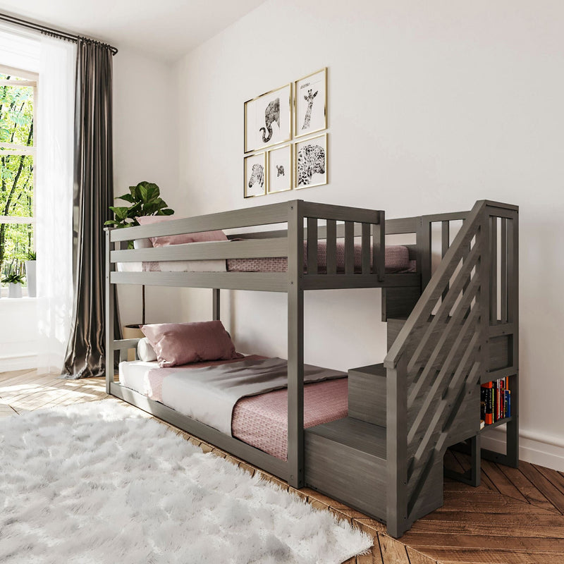 Elegant gray wooden bunk bed with stairs in a stylish children’s bedroom, featuring cozy pink bedding and decorative wall art.