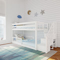 White wooden bunk bed with staircase and storage in a bright children's bedroom with striped rug and star wall decor