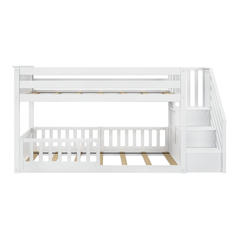 White twin over full bunk bed with staircase and railing, space-saving kids' room furniture.
