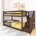 Modern dark wood twin-over-full bunk bed with staircase storage, yellow bedding and polka-dot pillow under fruit wall art in a kids' bedroom
