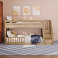 Modern wooden bunk bed with built-in staircase and storage in a blush-pink kids' room, sun wall art, white and mustard pillows, white bedding and blue plaid rug
