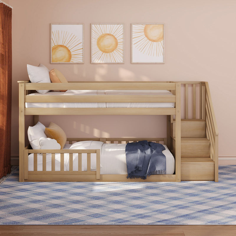 Natural wood bunk bed with built‑in stairs in a modern kids' bedroom, sun-themed framed wall art, beige walls, decorative pillows and blue plaid rug