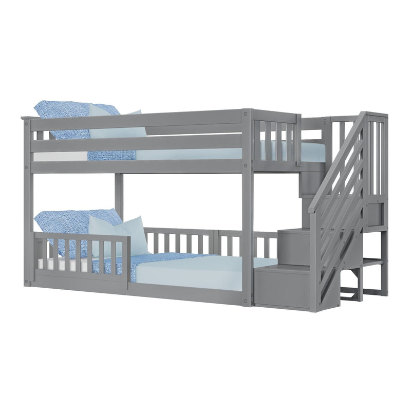 Gray twin-over-twin bunk bed with built-in staircase and blue bedding for kids' room.