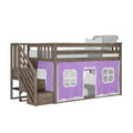 Kids loft bed with staircase and under-bed purple play tent curtain, weathered gray wood finish with built-in storage stairs and window panels, elevated children's bed with mattress and pillow