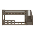 Gray-brown wooden twin-over-twin bunk bed with right-side staircase, slatted guardrails, platform slats and space-saving design