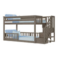 Gray oak-finish twin-over-full bunk bed with slatted guardrails and built-in staircase with storage drawers, modern farmhouse kids' bedroom furniture with light blue bedding