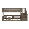 Gray wood twin-over-full bunk bed with right-side stairs, slatted guardrails and platform slats — space-saving kids bedroom furniture
