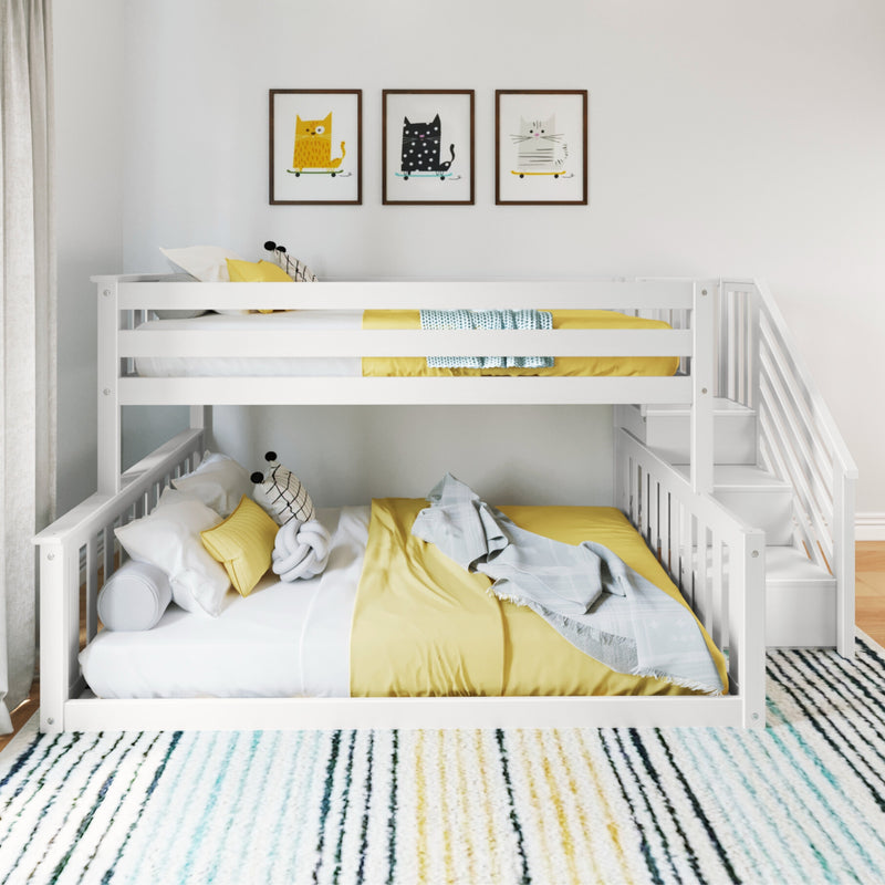 White bunk bed with yellow bedding in a modern kids' room featuring cat-themed wall art and striped rug.