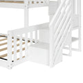White wooden children's twin bunk bed with staircase and built-in storage drawers, slatted guardrails and wooden mattress slats