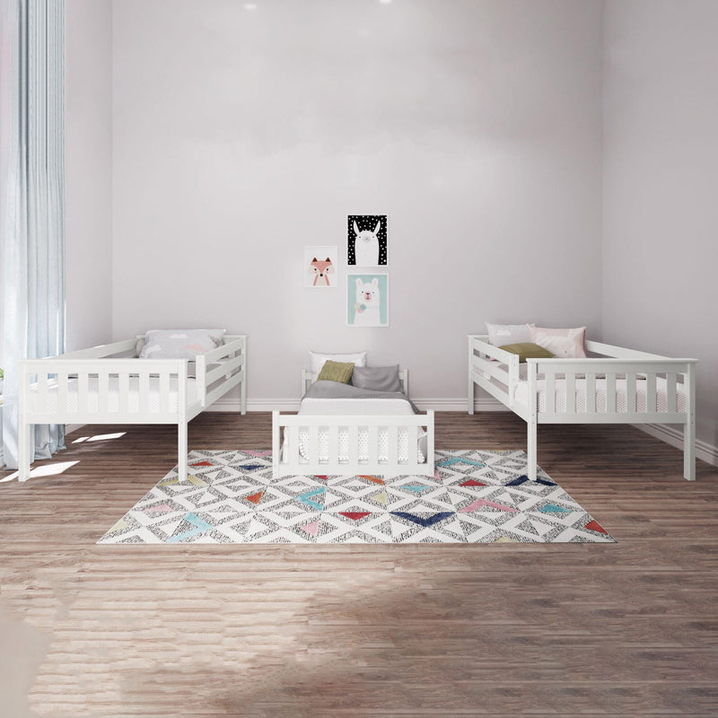 White children's bedroom with three matching toddler beds and wooden flooring.
