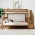 Solid wood bunk bed with built-in stairs in a modern neutral kids bedroom, blush bedding, framed black-and-white animal prints, potted plant, herringbone hardwood floor and textured white rug