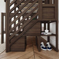 Dark wood loft bed with built-in staircase and cubby storage, magazines on shelf and navy sneakers on herringbone hardwood floor