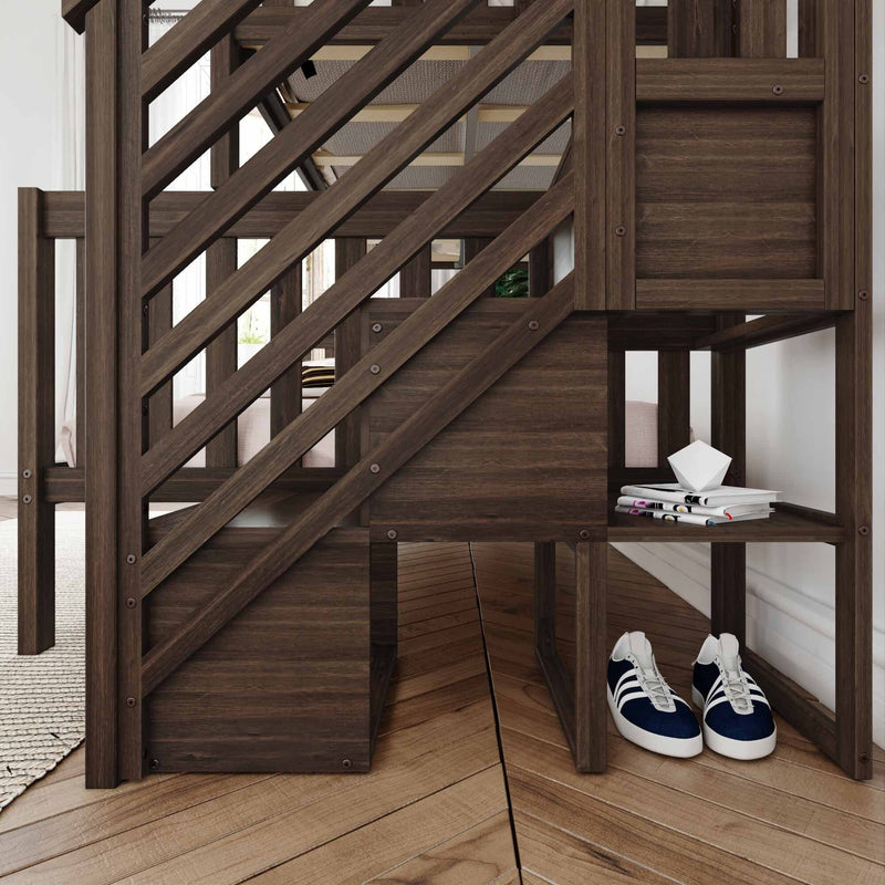Dark wood loft bed with built-in staircase and cubby storage, magazines on shelf and navy sneakers on herringbone hardwood floor