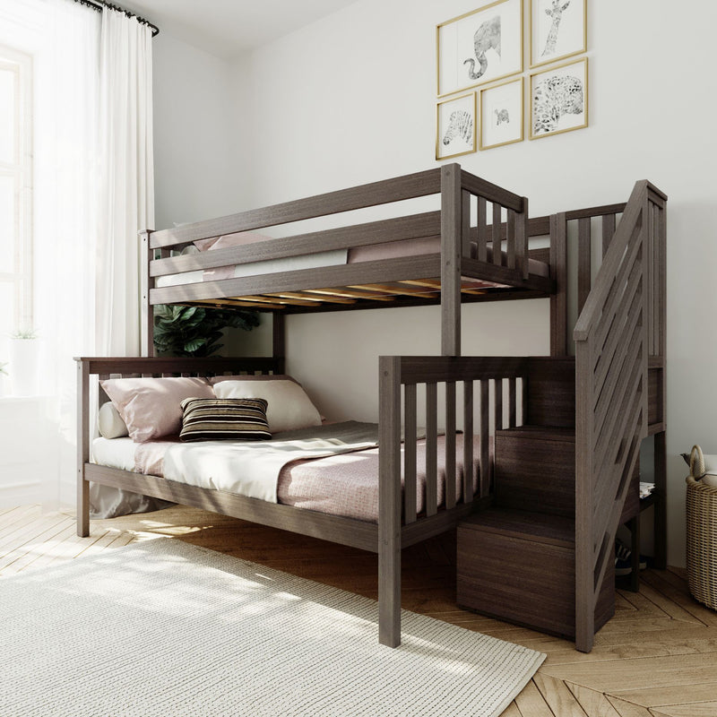 Modern dark wood twin-over-full bunk bed with built-in storage stairs in a bright neutral kids' bedroom with pink and white bedding and animal wall art