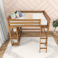 Wooden loft bed with ladder, built-in shelves and colorful pillows against a blush geometric accent wall in a modern kids' room