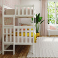 White wooden bunk bed in modern pastel kids bedroom with pink geometric wallpaper, yellow bedding accents, large window and indoor plant