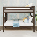 Dark wood twin-over-twin bunk bed with white bedding, blue gradient throw and decorative pillows against light blue geometric wallpaper in a children's bedroom