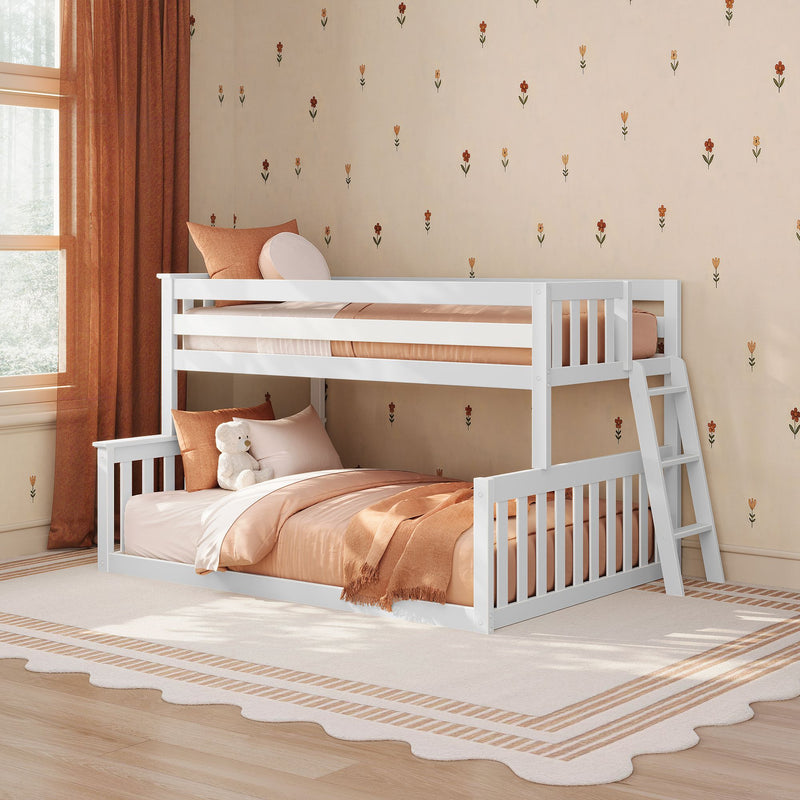 White wooden bunk bed (twin over full) in cozy kids bedroom with peach bedding, ladder, teddy and floral wallpaper