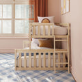 Natural light children's room with light wood twin-over-twin bunk bed and ladder, blush pink walls, rust curtains, blue plaid rug, and decorative pillows