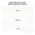 White marble-look surface finish samples labeled "Warm," "Neutral," and "Cool" illustrating how a finish's appearance varies under different lighting conditions