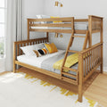 Solid wood bunk bed with ladder in bright modern bedroom, gray knit bedding and yellow accent pillows and throw, brass wall sconce and window