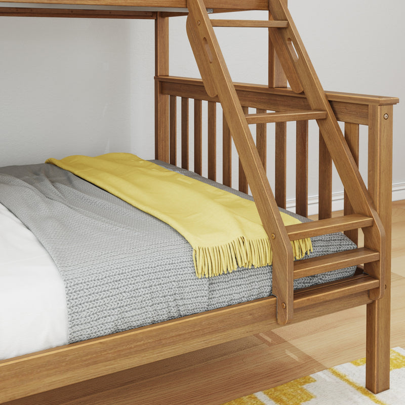 Close-up of wooden bunk bed ladder and slatted guardrail in natural wood finish with a gray knit blanket and yellow throw on the bed, modern bedroom interior