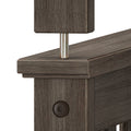 Close-up of dark brown wood furniture joint showing wood grain, chamfered edges, metal dowel pin and hex bolt connector
