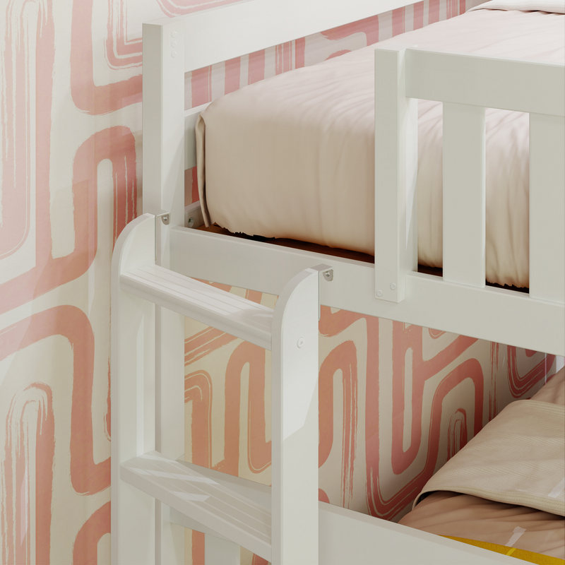 White wooden bunk bed ladder and guardrail against pink retro geometric wallpaper with soft beige bedding in a modern kids' bedroom