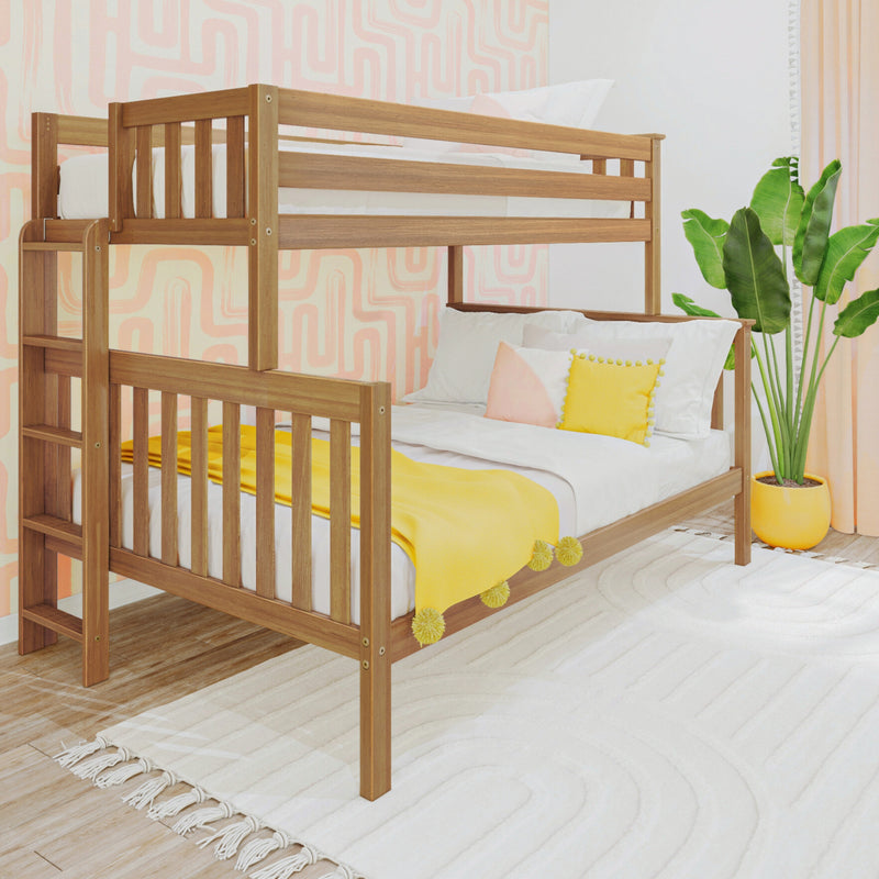 Two-level wooden bunk bed in bright kids' bedroom with yellow throw blanket and pillows, pink geometric wallpaper, white rug, and potted plant