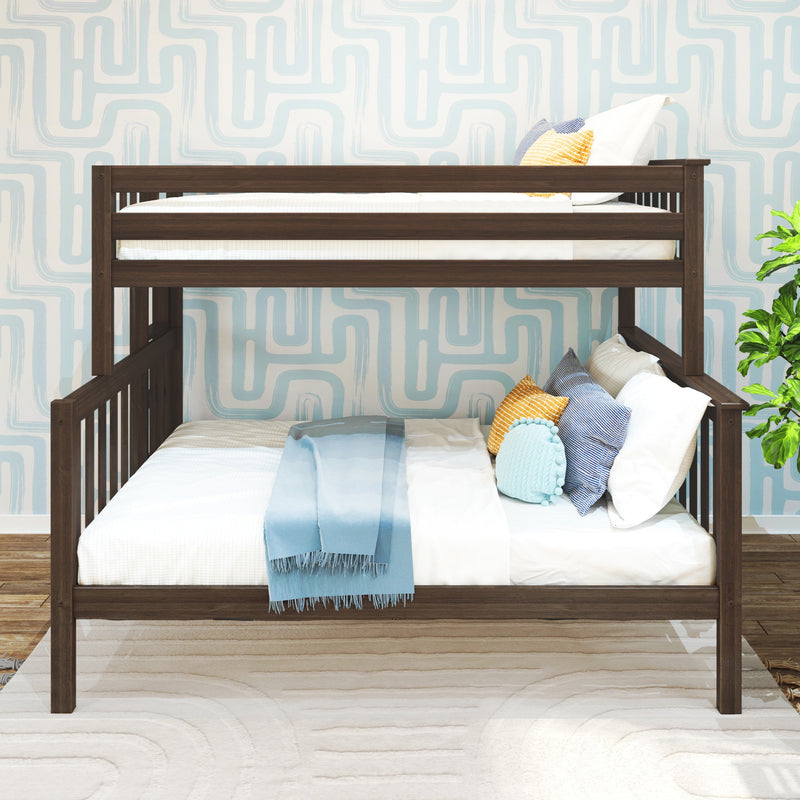 Dark wood bunk bed with white bedding and blue throw, colorful accent pillows and potted plant against light blue geometric wallpaper in a modern kids' bedroom