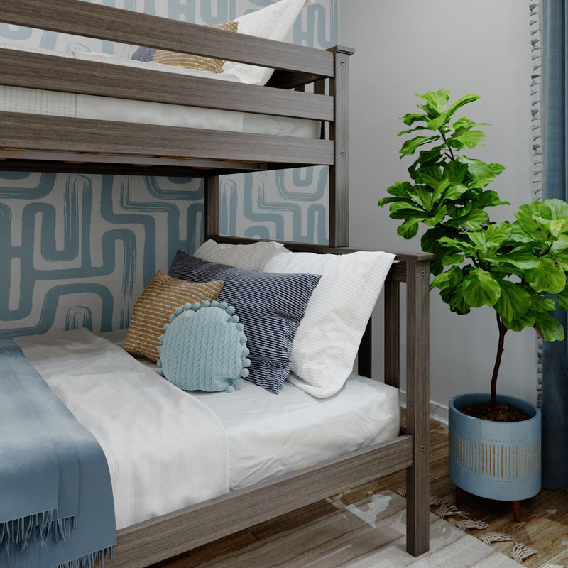 Bunk bed with modern decor, blue and gold pillows, geometric wallpaper, and indoor plant for stylish bedroom design.