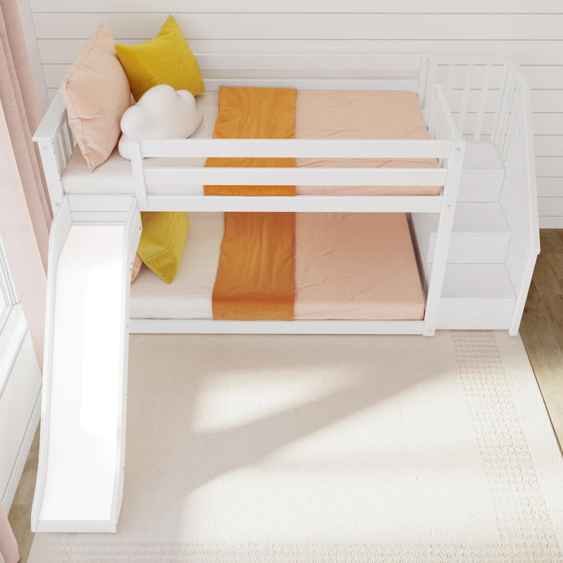 Children's white bunk bed with slide, orange bedding, and yellow pillows in a bright bedroom.