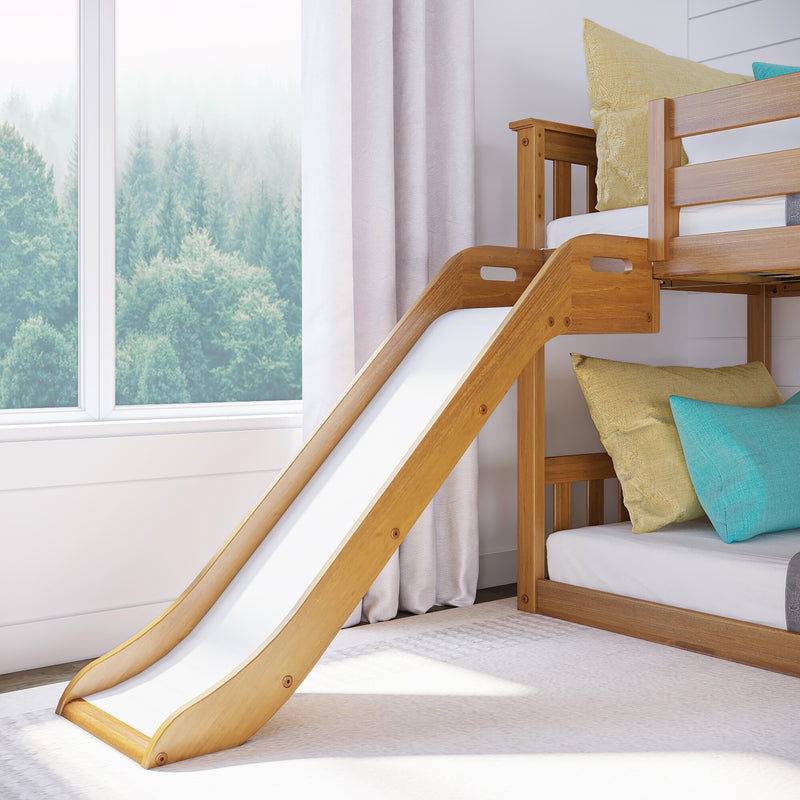 Wooden bunk bed with slide in cozy children's bedroom, featuring sunlight through a large window and colorful cushions.