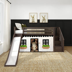 Children’s loft bed with playhouse design, slide, and storage stairs against a black paneled wall in a cozy bedroom.