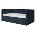 Modern navy blue upholstered daybed sofa bed with high back and side rails and white twin mattress on white background
