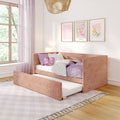 Pastel pink girls' bedroom with blush upholstered trundle daybed, lavender bedding, butterfly pillow, floral wall art and sheer curtains