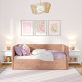 Pastel pink girls' bedroom with upholstered pink daybed, butterfly pillow and lavender bedding, framed floral wall art, rattan pendant light and matching bedside lamps