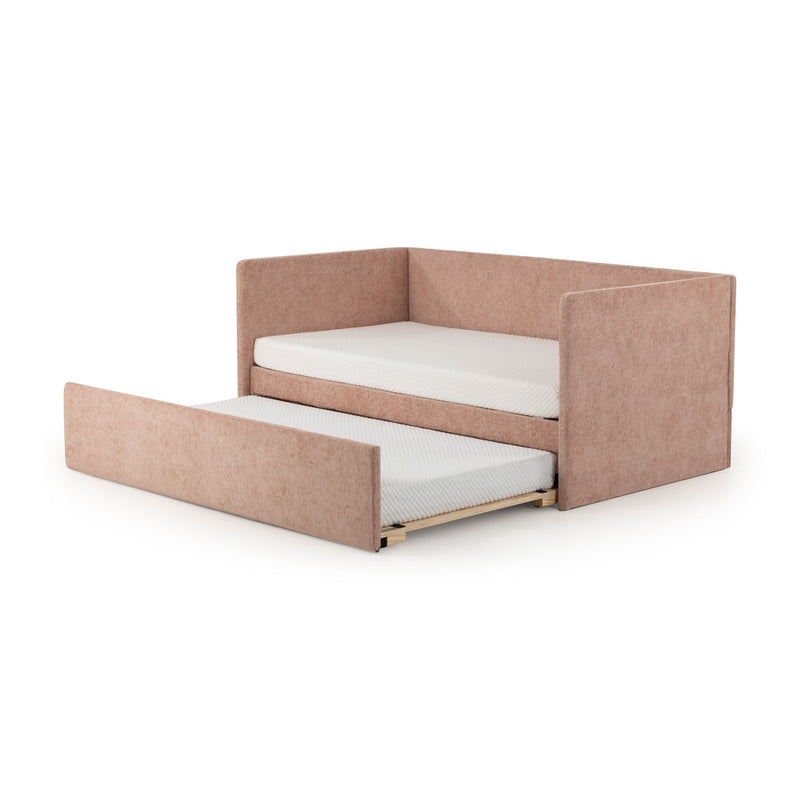 Blush pink upholstered trundle daybed with pull-out mattress and padded side rails, modern convertible kids' sofa bed
