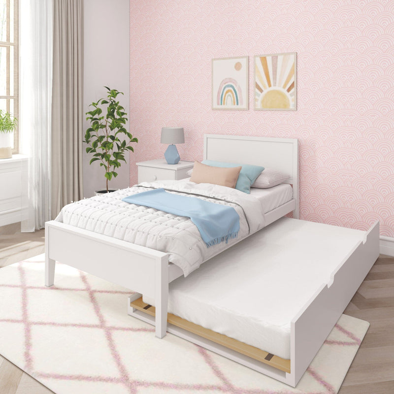 Children's bedroom with white trundle bed, pastel decor, pink patterned wallpaper, and modern furniture.