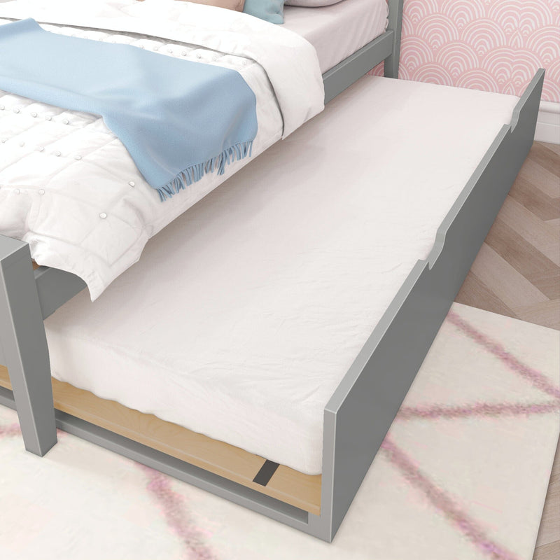 Gray trundle bed with white bedding in a modern bedroom setting.