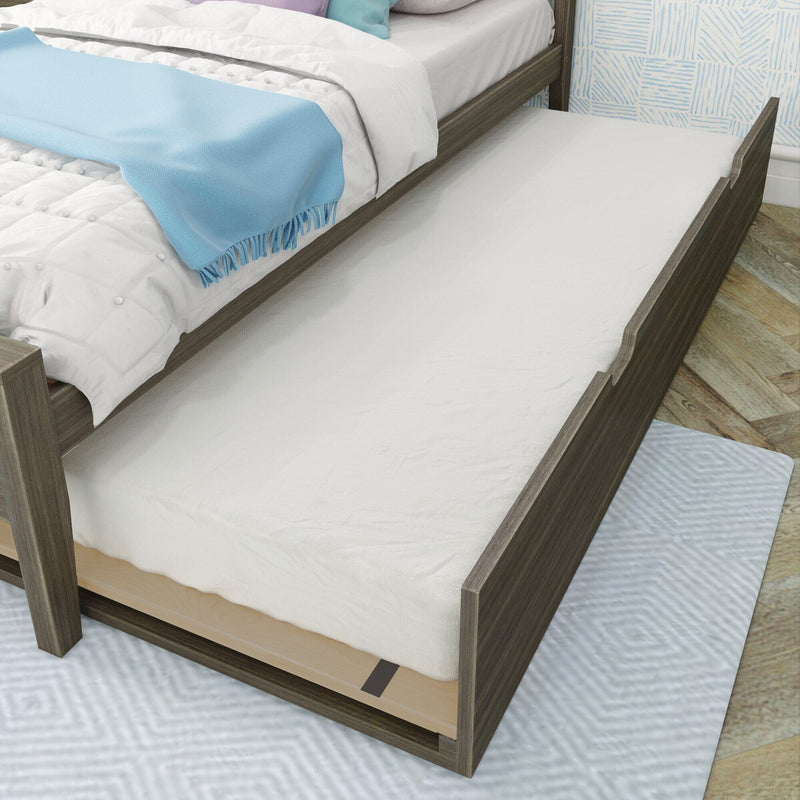Wooden bed with pull-out trundle bed for extra sleeping space in modern bedroom.