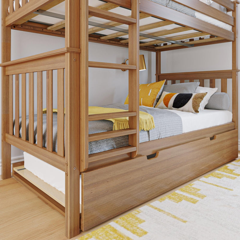 Solid wood bunk bed with built-in ladder, under-bed storage drawer and pull-out trundle, gray knit bedding and yellow accent pillows in a modern kids' bedroom