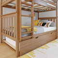 Solid wood bunk bed with built-in ladder, under-bed trundle drawer and yellow accent pillows on gray bedding in a modern kids' bedroom with natural wood finish