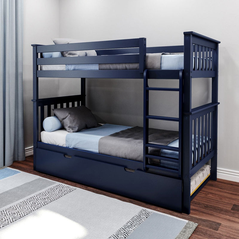 Navy blue wooden bunk bed with ladder and pull-out trundle drawer in modern kids' bedroom with blue and gray bedding, hardwood floor and patterned area rug
