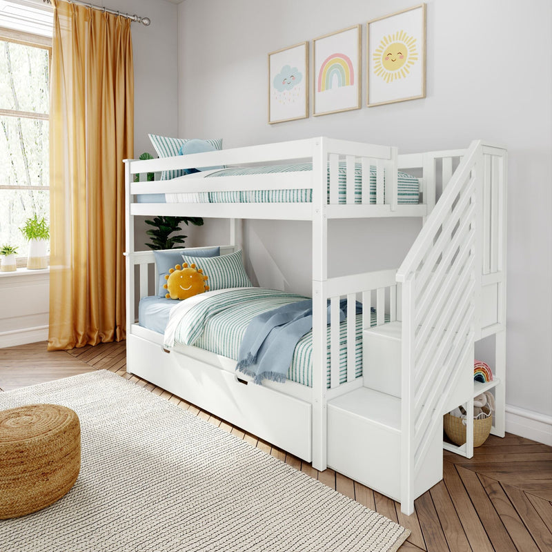 White wooden bunk bed with staircase in a bright, cozy children's room featuring colorful bedding, wall art, and natural light through large windows.