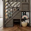 Rustic gray wooden kids loft bed with diagonal railing, built-in storage cubbies, rainbow night light and wicker toy basket