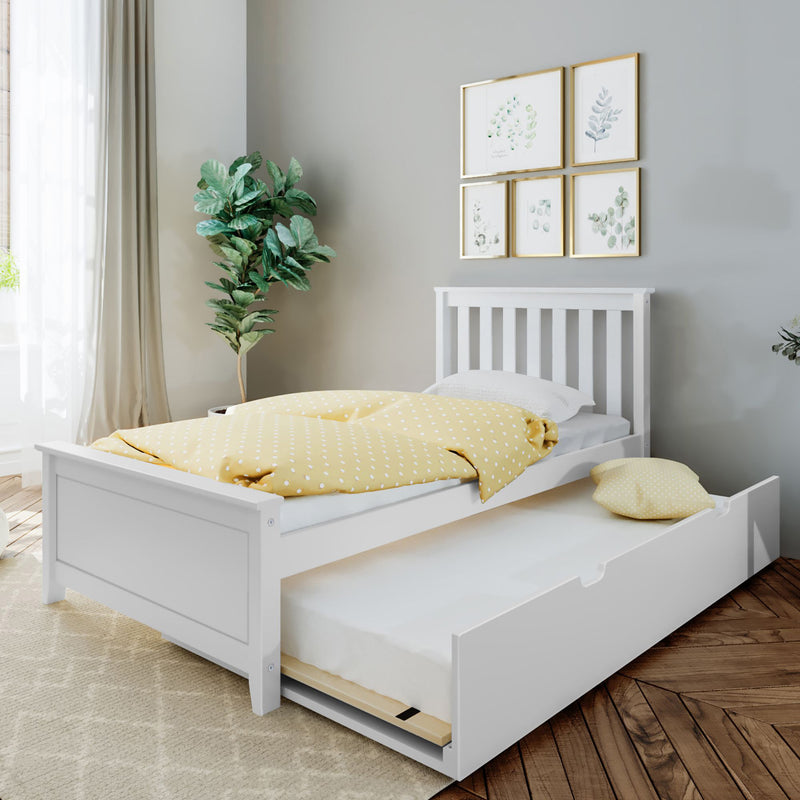 White twin trundle bed with yellow polka-dot duvet and under-bed storage in a small modern kids bedroom with plant and botanical prints