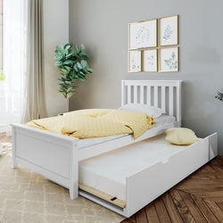 White wooden twin trundle bed with pull-out storage mattress, yellow polka-dot duvet and pillow in a bright modern kids' bedroom with fiddle leaf fig plant, framed botanical gallery wall and hardwood floors